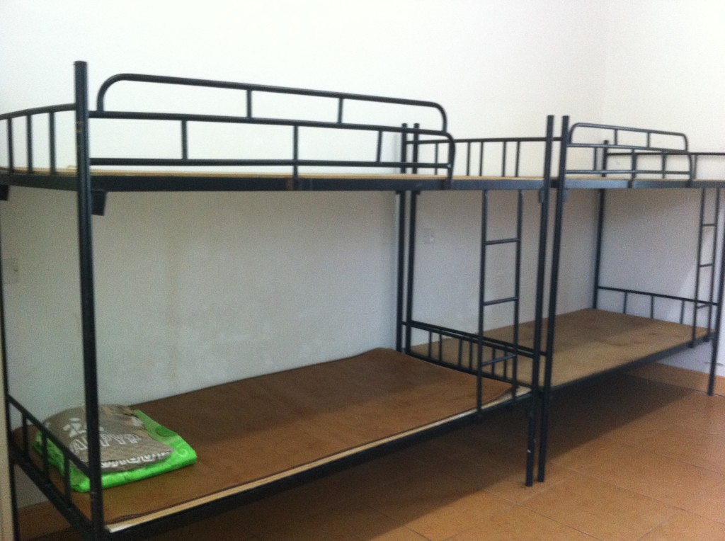 A wooden bed...it really is as uncomfortable as it looks!