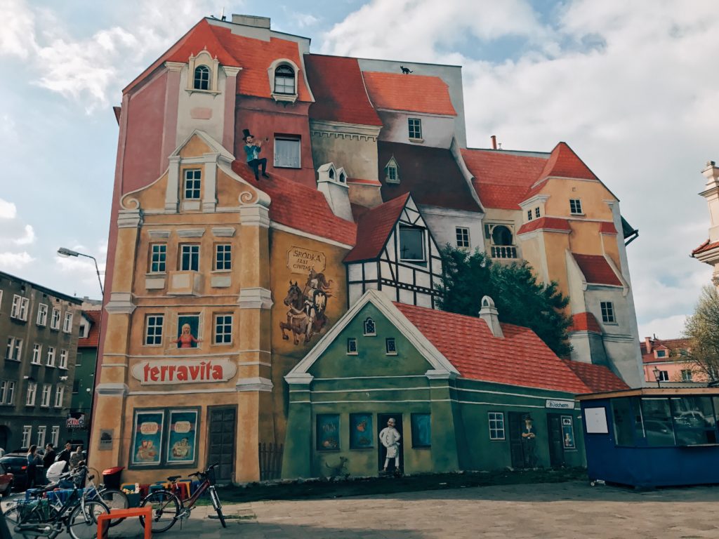 Śródka Tale with Trumpeter on the Roof and Cat in the Background